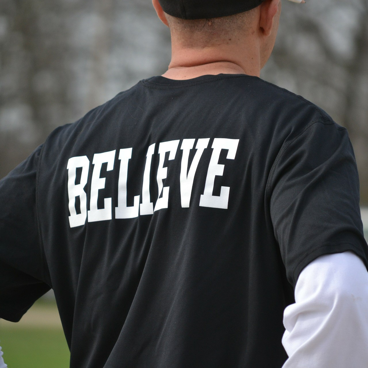 Man Wearing Believer Shirt